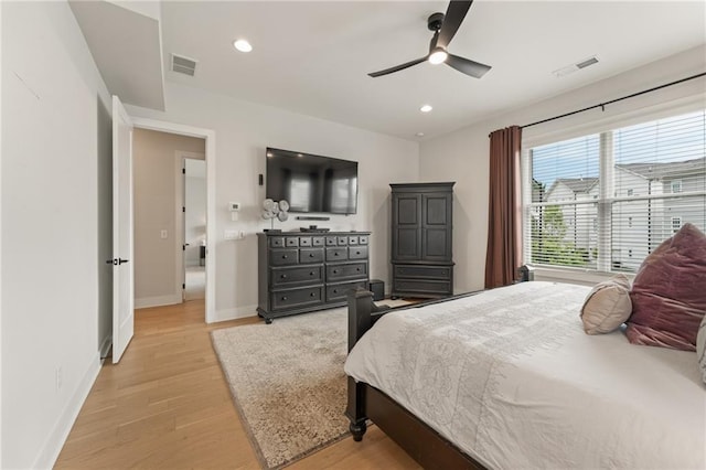 bedroom with ceiling fan and light wood-type flooring