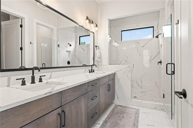 bathroom with vanity, a wealth of natural light, and walk in shower