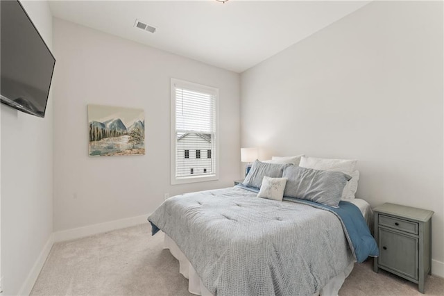 bedroom with light carpet