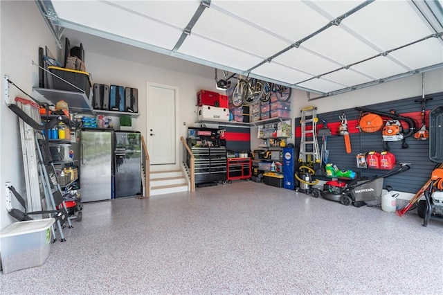 garage featuring stainless steel fridge