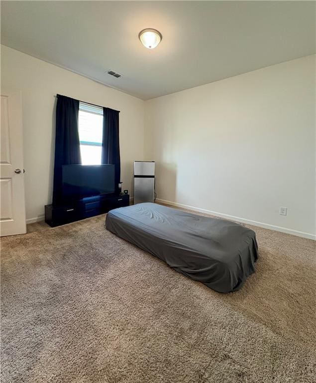 bedroom featuring visible vents, carpet, and baseboards