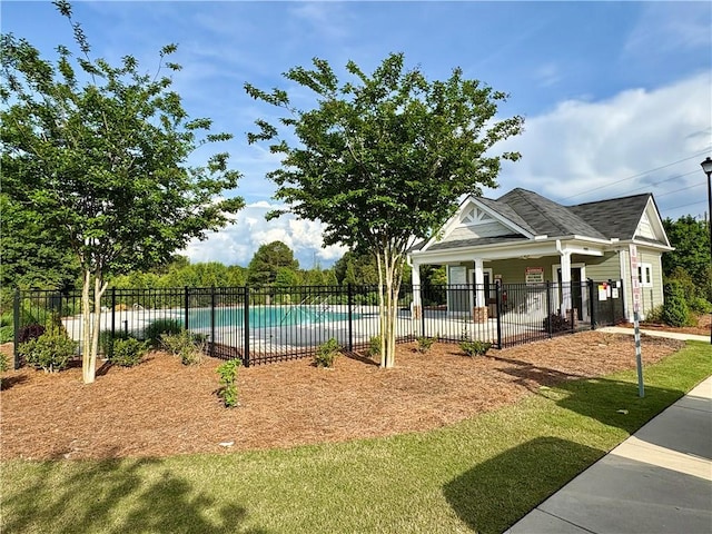 view of swimming pool featuring a fenced in pool and fence