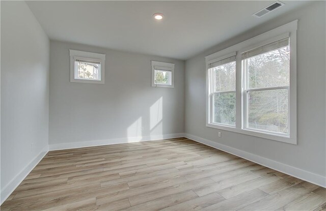 unfurnished room featuring light hardwood / wood-style flooring