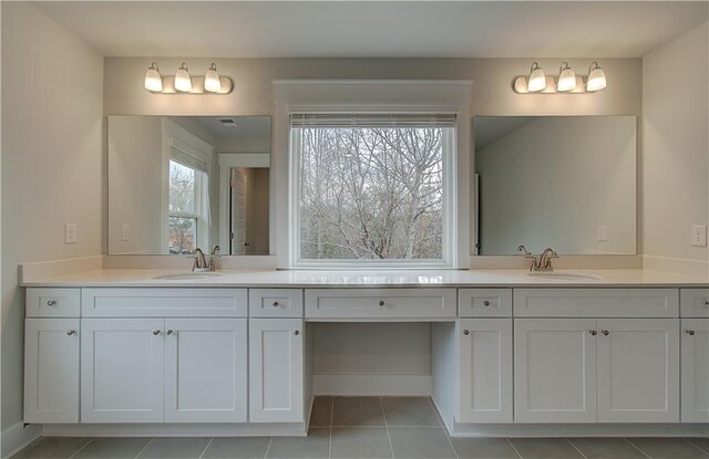 bathroom featuring tile patterned floors and vanity