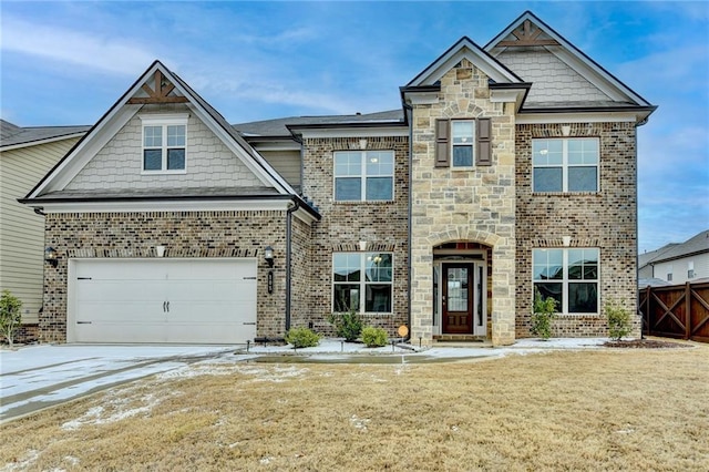 craftsman inspired home with a garage and a front lawn