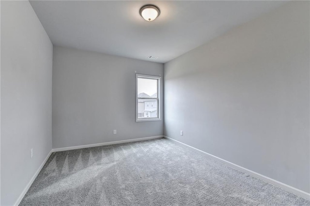 unfurnished room with carpet floors