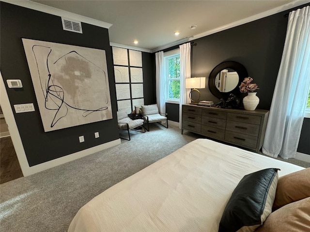 carpeted bedroom featuring ornamental molding