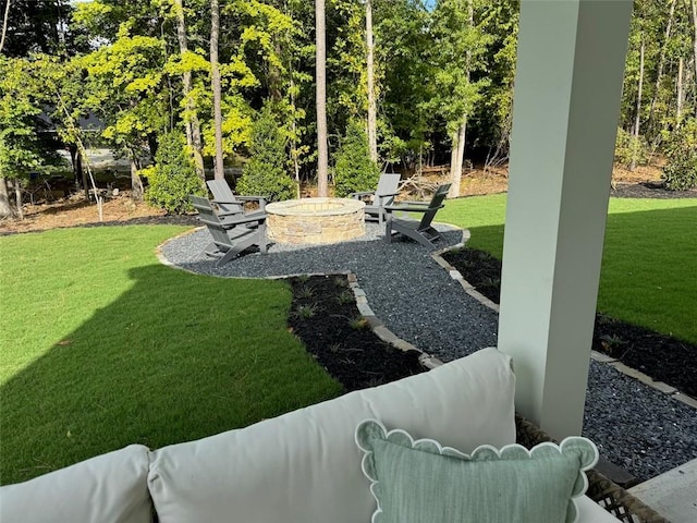 view of yard with a fire pit