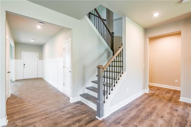 stairway with wood-type flooring