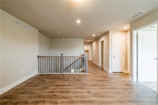 corridor featuring hardwood / wood-style flooring