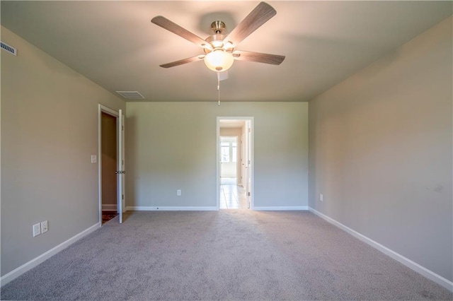 carpeted empty room with ceiling fan