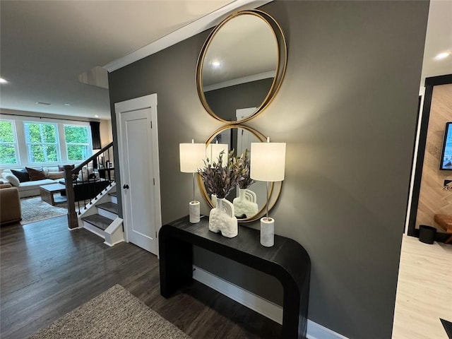 interior space with hardwood / wood-style floors and ornamental molding