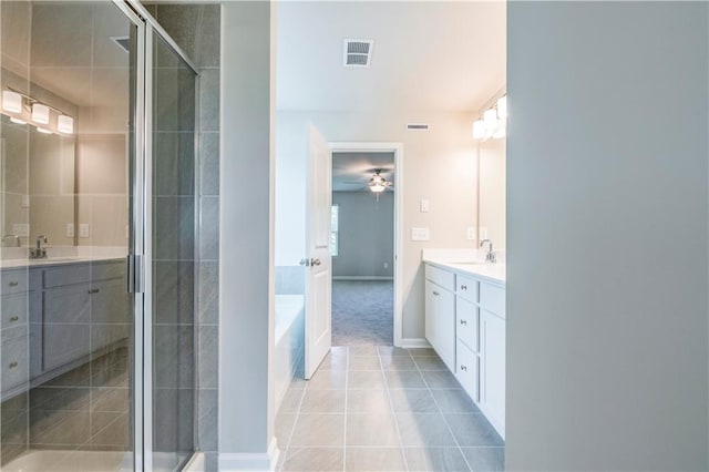 bathroom with vanity, separate shower and tub, and tile patterned flooring