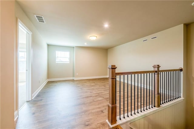 unfurnished room featuring light hardwood / wood-style floors