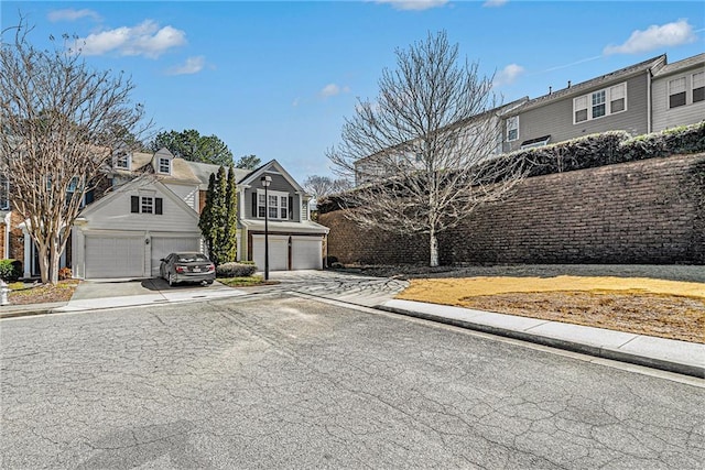 view of front facade featuring concrete driveway