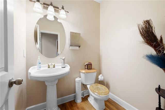 1227 Castle Point Ct SW, Conyers, GA 30094 - bathroom with toilet and wood finished floors
