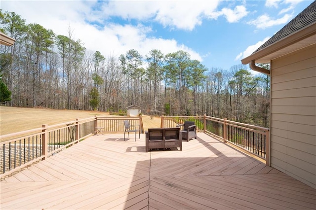 1227 Castle Point Ct SW, Conyers, GA 30094 - wooden terrace featuring a storage shed and a wooded view
