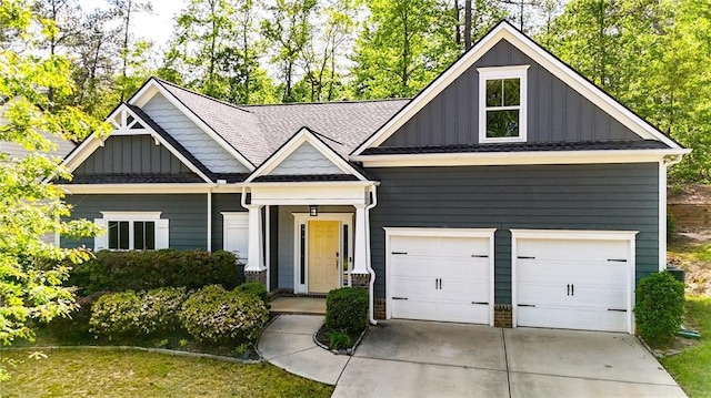 view of front of home with concrete driveway and board and batten siding