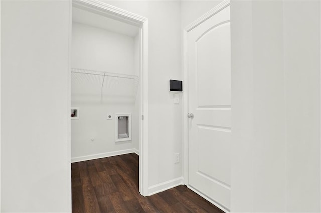clothes washing area with laundry area, gas dryer hookup, baseboards, electric dryer hookup, and dark wood-style flooring
