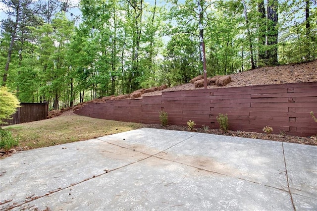 view of patio / terrace featuring fence