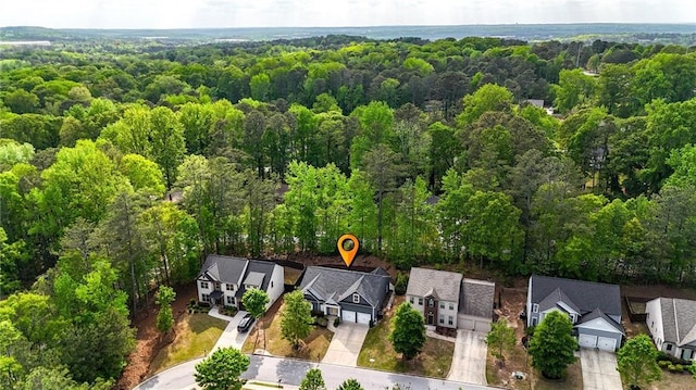 bird's eye view with a residential view and a wooded view