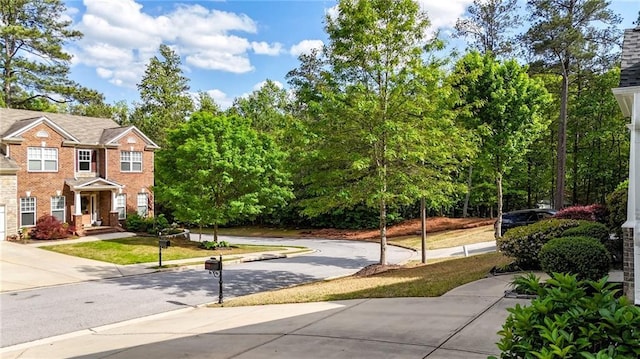 view of property's community featuring driveway