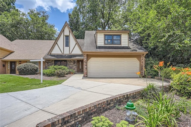 12 Westchester Sq, Decatur, GA 30030 - tudor home with driveway, brick siding, an attached garage, and a front lawn