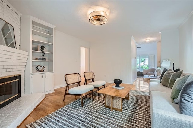 12 Westchester Sq, Decatur, GA 30030 - living area featuring light wood finished floors, crown molding, and a fireplace