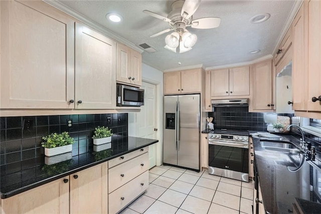 12 Westchester Sq, Decatur, GA 30030 - kitchen featuring stainless steel appliances, under cabinet range hood, a ceiling fan, light tile patterned floors, and tasteful backsplash