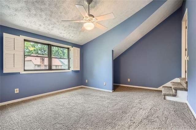 12 Westchester Sq, Decatur, GA 30030 - bonus room featuring a textured ceiling, carpet flooring, ceiling fan, stairs, and lofted ceiling