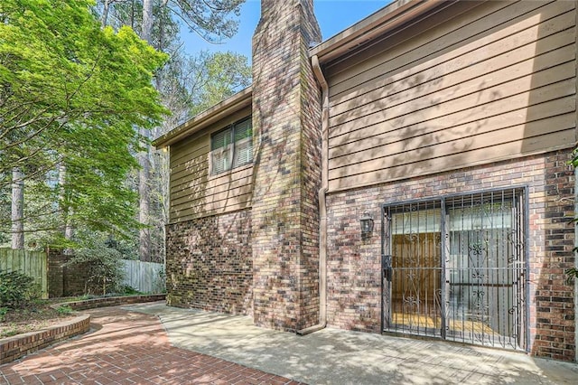 12 Westchester Sq, Decatur, GA 30030 - entrance to property featuring a patio area, a chimney, and brick siding