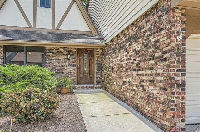 12 Westchester Sq, Decatur, GA 30030 - doorway to property featuring brick siding and a garage