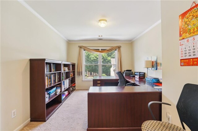 office area featuring light carpet, baseboards, and crown molding