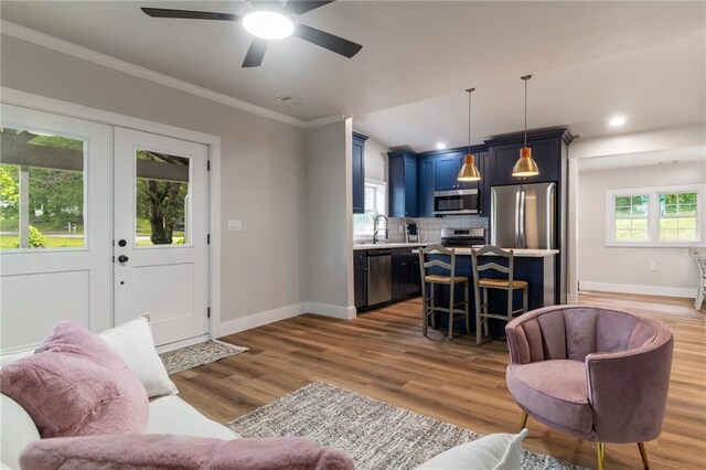 235 Lowry St, Ball Ground, GA 30107 - living area with baseboards, ornamental molding, wood finished floors, ceiling fan, and recessed lighting