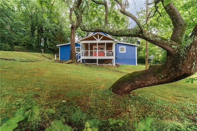 235 Lowry St, Ball Ground, GA 30107 - view of outdoor structure with a sunroom