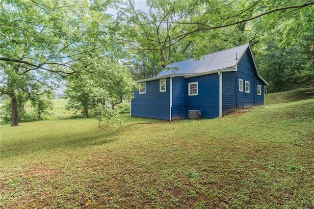 235 Lowry St, Ball Ground, GA 30107 - view of side of property with cooling unit, a lawn, and metal roof