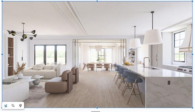 living room featuring an inviting chandelier, crown molding, and wood finished floors