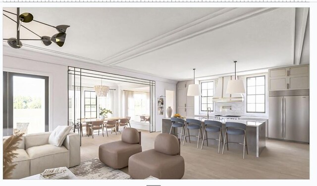 living area featuring a chandelier and light wood-style floors