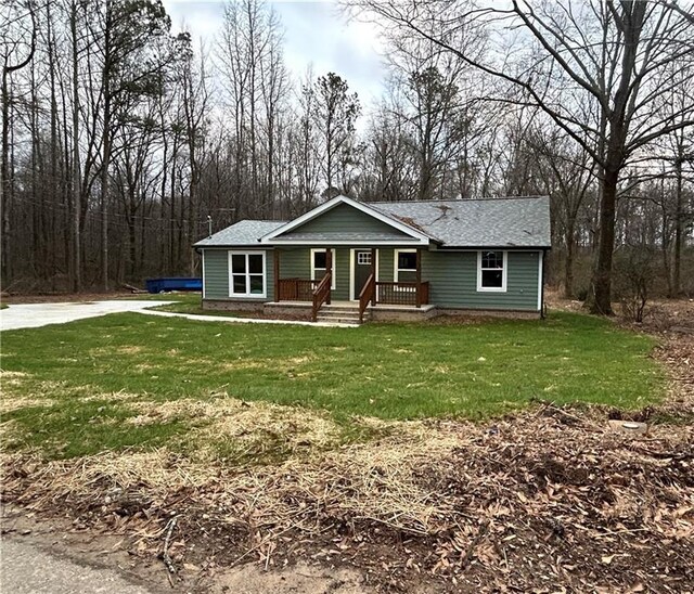 10033 Florence Cir, Villa Rica, GA 30180 - view of front of home featuring a front yard and covered porch