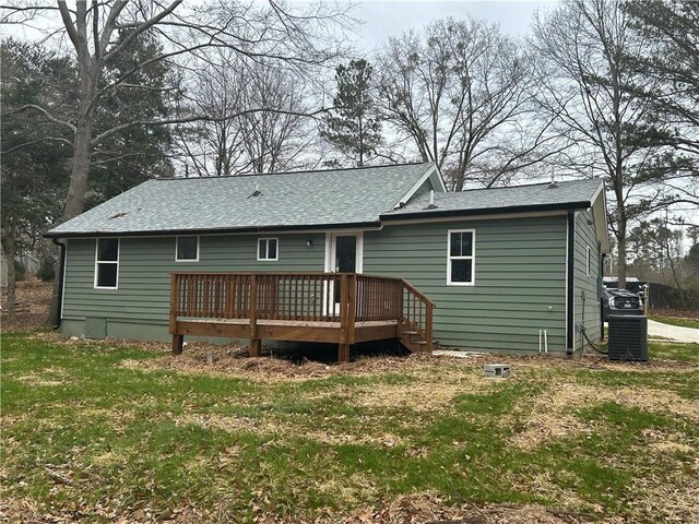 10033 Florence Cir, Villa Rica, GA 30180 - rear view of house featuring central air condition unit, a deck, and a yard