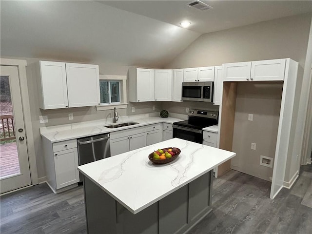 10033 Florence Cir, Villa Rica, GA 30180 - kitchen with stainless steel appliances, white cabinets, a kitchen island, and sink