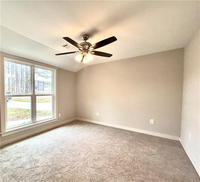 unfurnished room featuring vaulted ceiling and ceiling fan