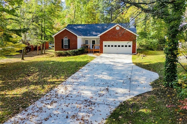 ranch-style house with a garage and a front lawn