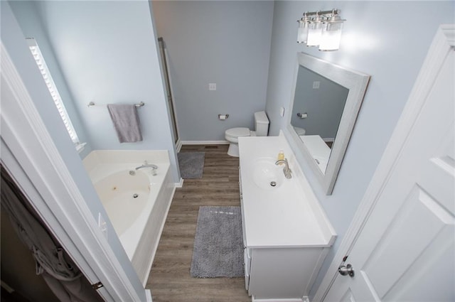 full bathroom featuring hardwood / wood-style flooring, vanity, shower with separate bathtub, and toilet