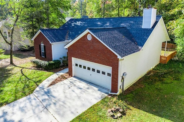 view of front of house with a garage and a front yard