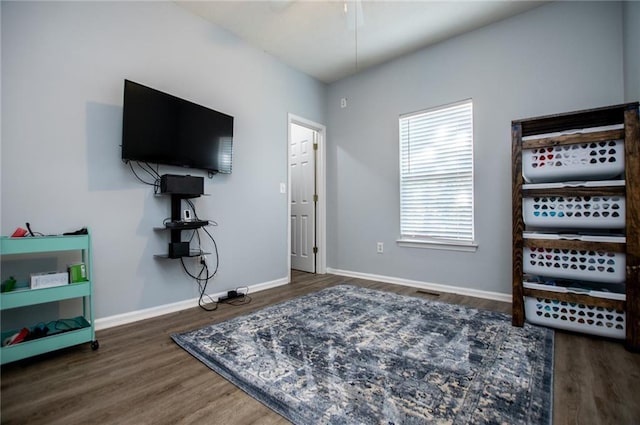 living area with dark wood-type flooring