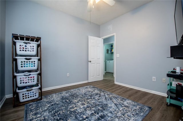 interior space featuring washer / clothes dryer, dark hardwood / wood-style floors, and ceiling fan