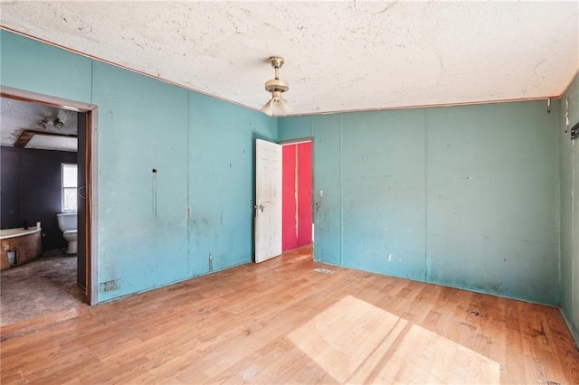 empty room with hardwood / wood-style floors