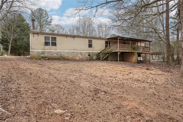 back of property featuring a deck