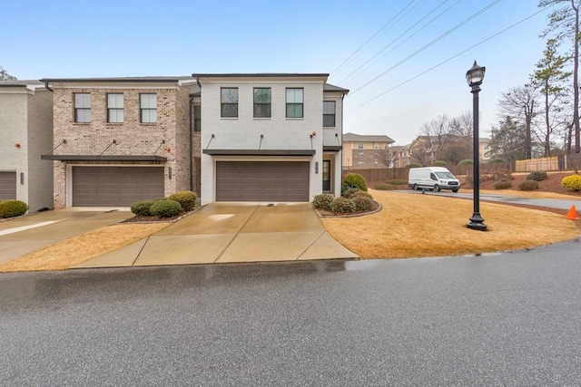 multi unit property featuring a garage